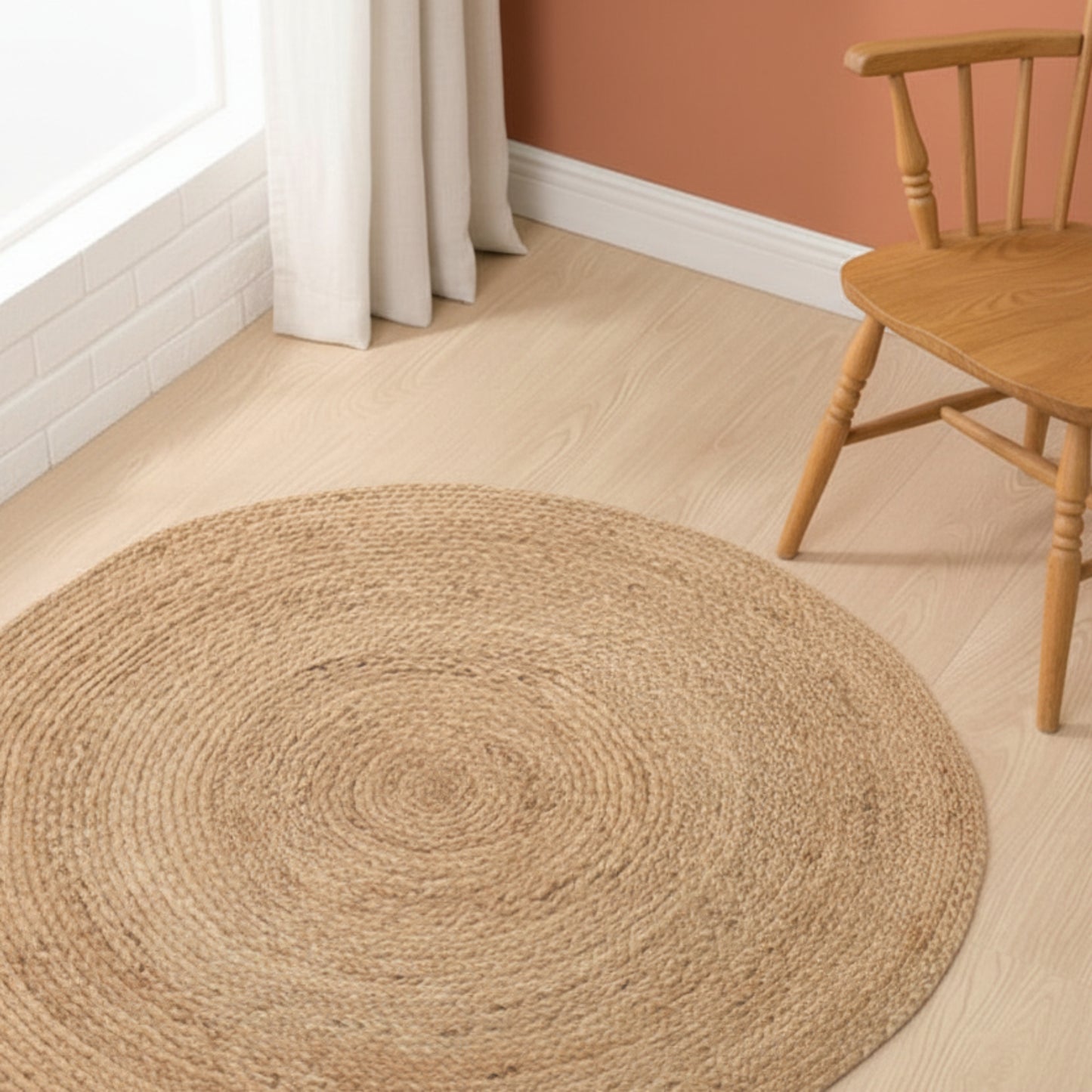 Hand-woven rattan carpet on a wooden surface and a brown wall background. wooden stool in the background. A warm minimalist interior with natural colors and simple design.