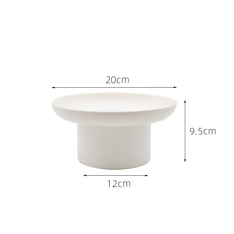 Round white storage tray with measurements on a white background. Minimalist home decor. Timeless and minimalist design.