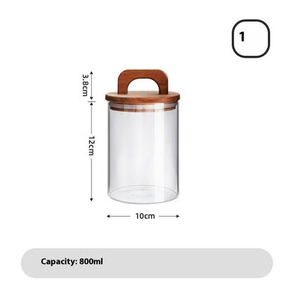 A set of clear glass sealed storage tanks with wooden lids, in various sizes, used for storing dry food and spices - with measurements on a white background. 