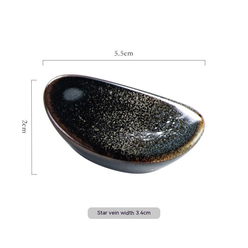 Stylish black star vein ceramic chopsticks holder, Japanese style with measurements on a white background. Modern kitchen accessories.   