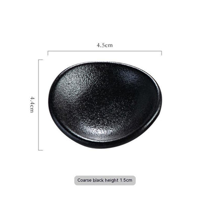 Stylish coarse black ceramic chopsticks holder, Japanese style with measurements on a white background. Modern kitchen accessories.   