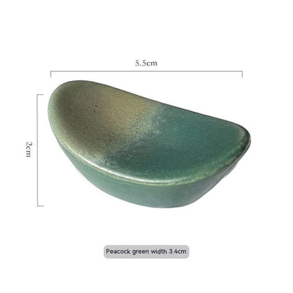 Stylish peacock green ceramic chopsticks holder, Japanese style with measurements on a white background. Modern kitchen accessories.   