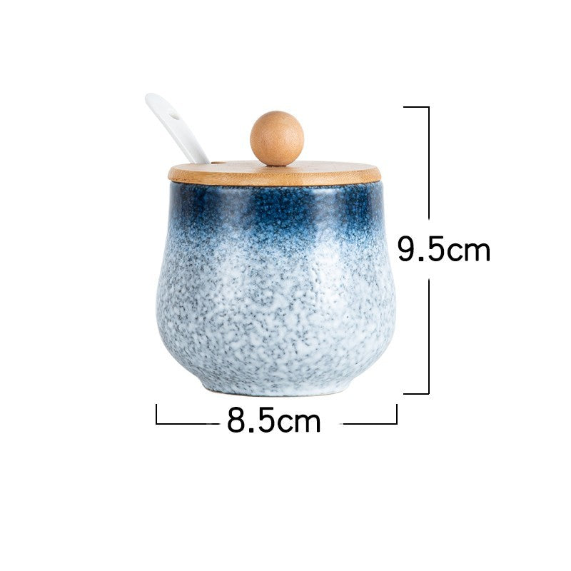 A set of ceramic jars with Japanese style designs, featuring a speckled blue and white pattern on a white background with measurements. The jars comes with a wooden  lid. 