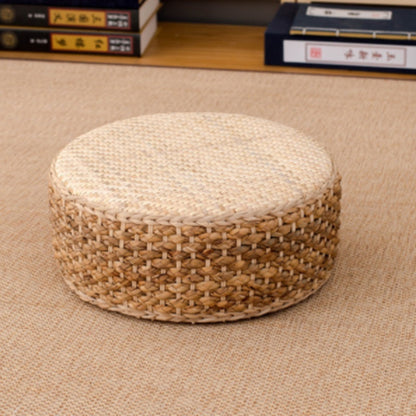 Woven ottoman on a beige carpet with books in the background. 
Earthy home decor inspired by natural textures and warm tones. Perfect for creating a calm, cozy interior with timeless minimalist design.