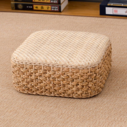 Woven ottoman with a cushion on a beige carpet. 
Earthy home decor inspired by natural textures and warm tones. Perfect for creating a calm, cozy interior with timeless minimalist design.