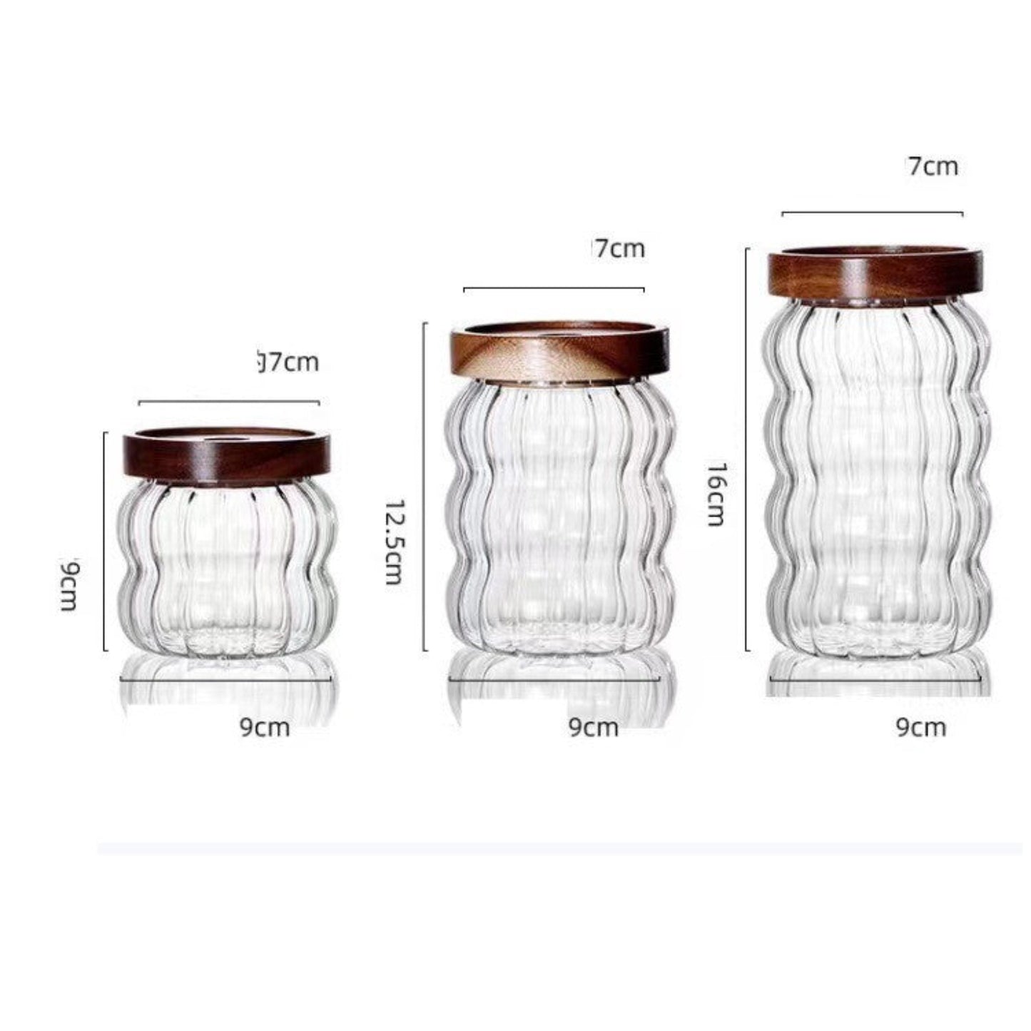 Three glass jars with wooden lids and their dimensions on a white background. Scandinavian kitchen decor inspired. Simplicity, natural materials, earthy, warm, pure. 