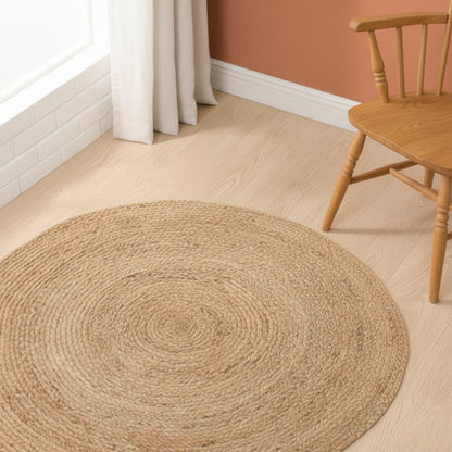 Hand-woven rattan carpet on a wooden surface and a brown wall background. wooden stool in the background. A warm minimalist interior with natural colors and simple design. 