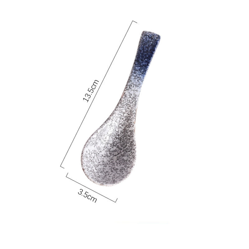A handcrafted ceramic spoons with a speckled pattern in shades of blue, grey and white on a white background and measurements. Handcrafted ceramic spoon in different colors. 