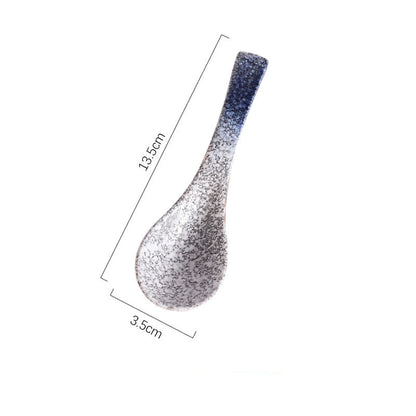 A handcrafted ceramic spoons with a speckled pattern in shades of blue, grey and white on a white background and measurements. Handcrafted ceramic spoon in different colors. 