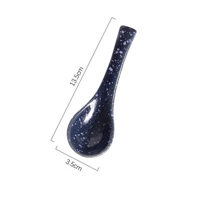 A handcrafted ceramic spoons with a speckled pattern in shades of blue, grey and white on a white background and measurements. Handcrafted ceramic spoon in different colors. 