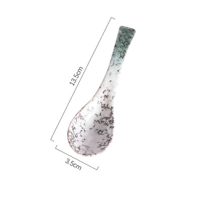 A handcrafted ceramic spoons with a speckled pattern in shades of white, brown, grey and green on a white background and measurements. Handcrafted ceramic spoon in different colors. 