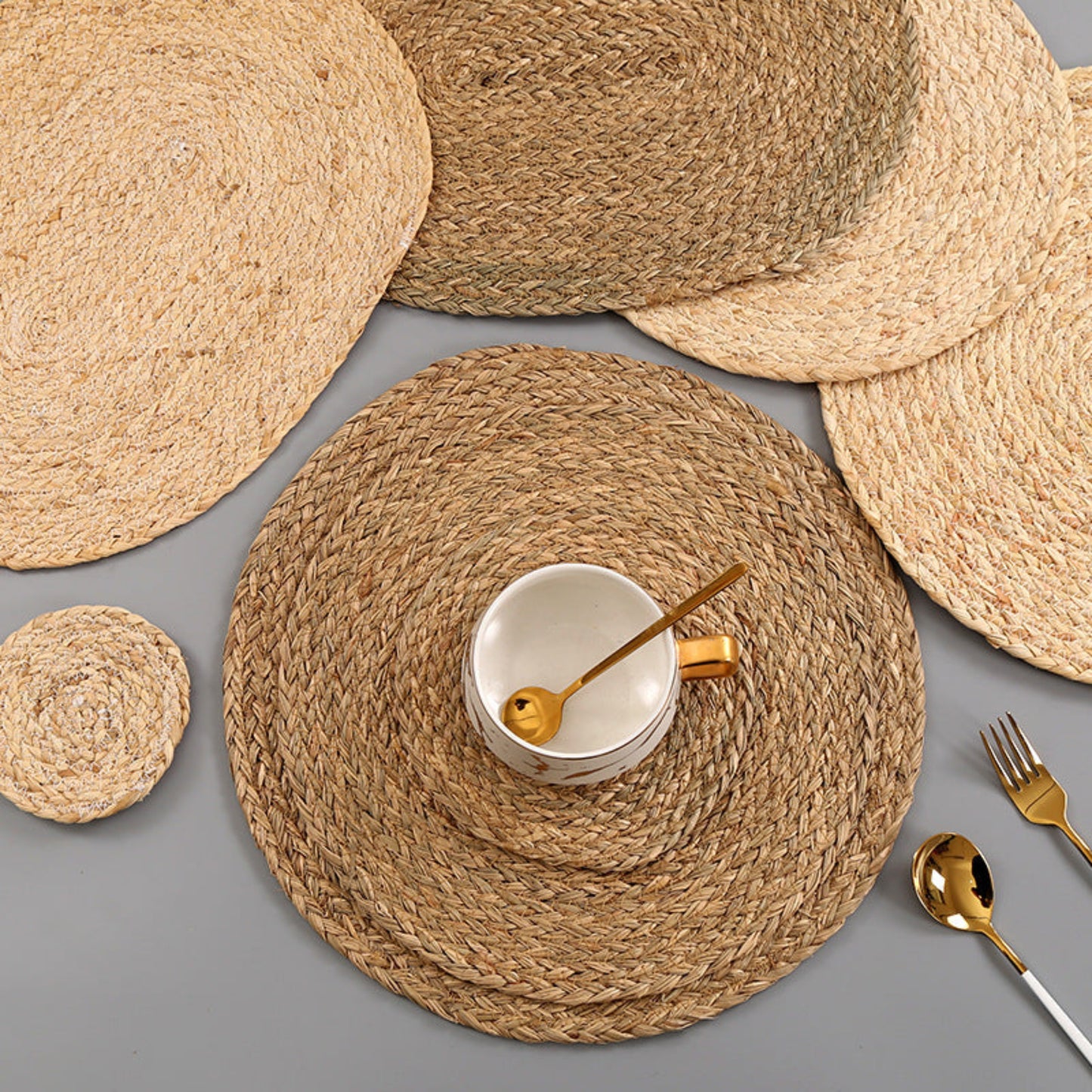 Beige and brown table set on a grey table and a cup on it . Handmade natural decor for calm and earthy tables. 