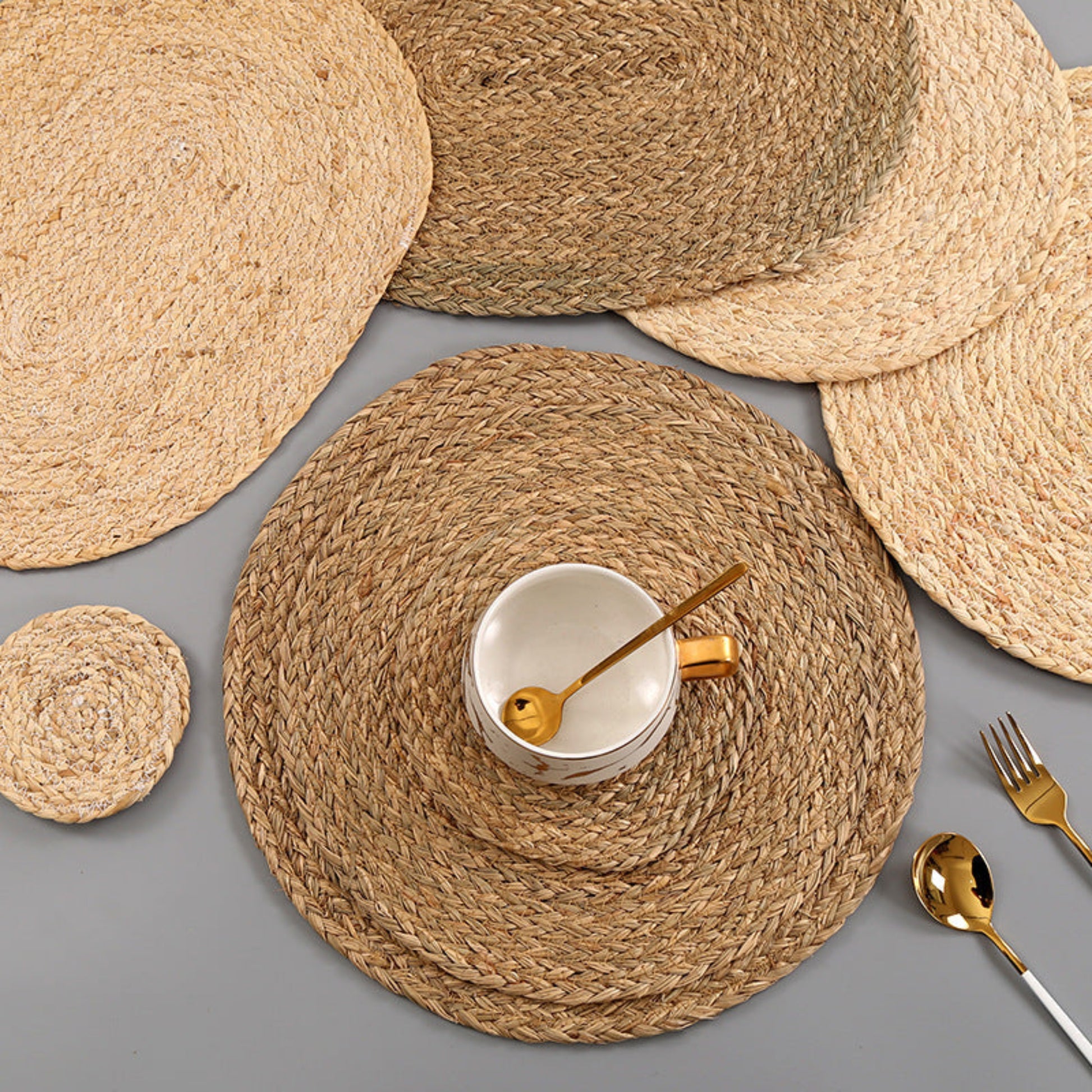 Beige and brown table set on a grey table and a cup on it . Handmade natural decor for calm and earthy tables. 