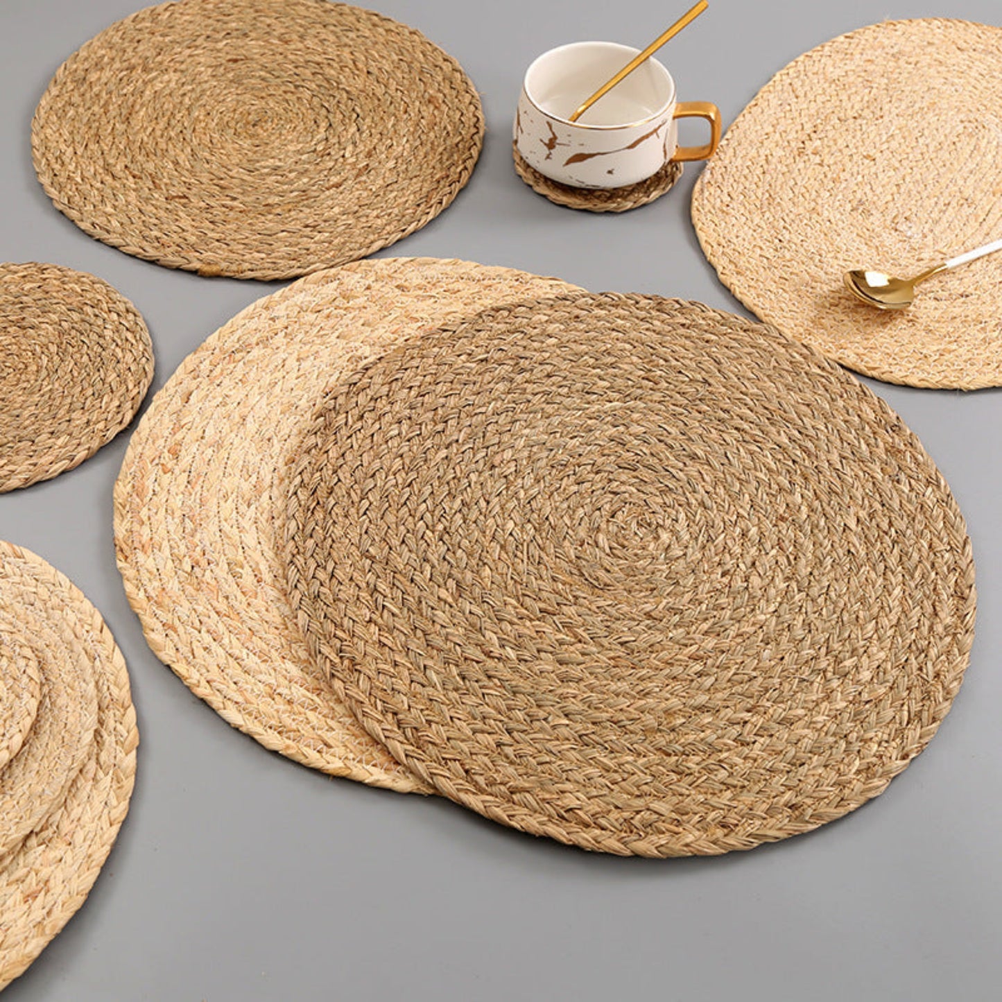 Beige and brown table set on a grey table and a cup. Handmade natural decor styling for calm and earthy tables. 