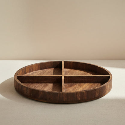 Wooden plate on a table. Natural decor styling in a modern, minimalist room/kitchen. Minimalist pieces designed to bring warmth and harmony. Beige Background. 