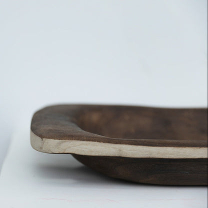 white  background with a centerpiece wooden tray (close up) in the front. Natural home decor designed with warm earthy tones and organic materials. 