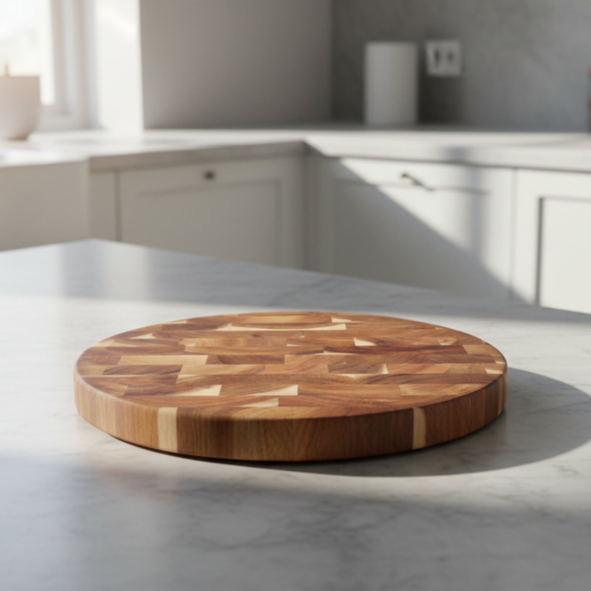 Round solid wood cutting board with a geometric pattern on a white kitchen background and on a light grey marble kitchen surface.