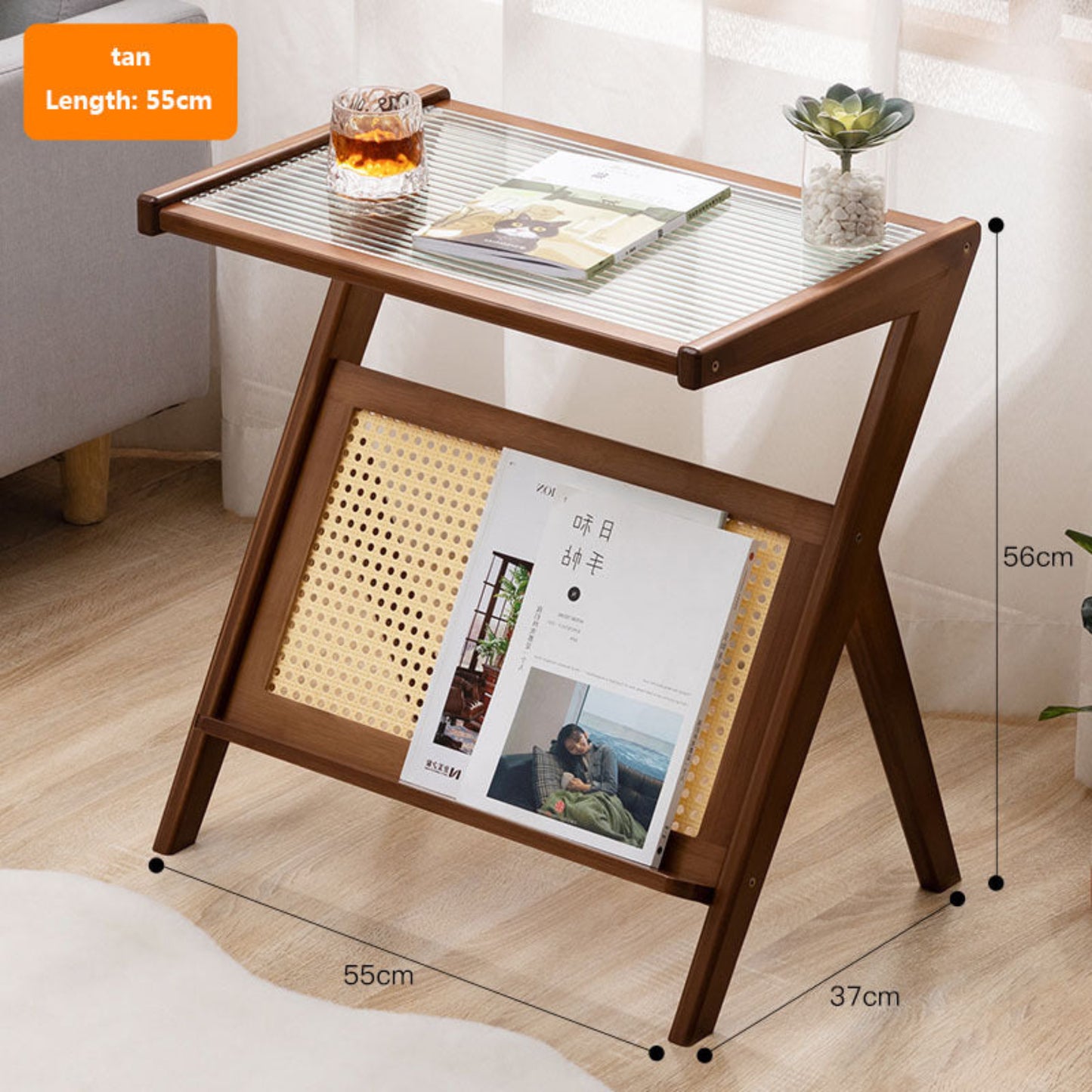 Wooden side table with glass top, books, and a glass of tea in a room setting. Minimalist Japanese bamboo furniture on a wooden floor and a white curtain in the background. Clean lines, natural materials, and timeless pieces that bring warmth and balance to every home. 