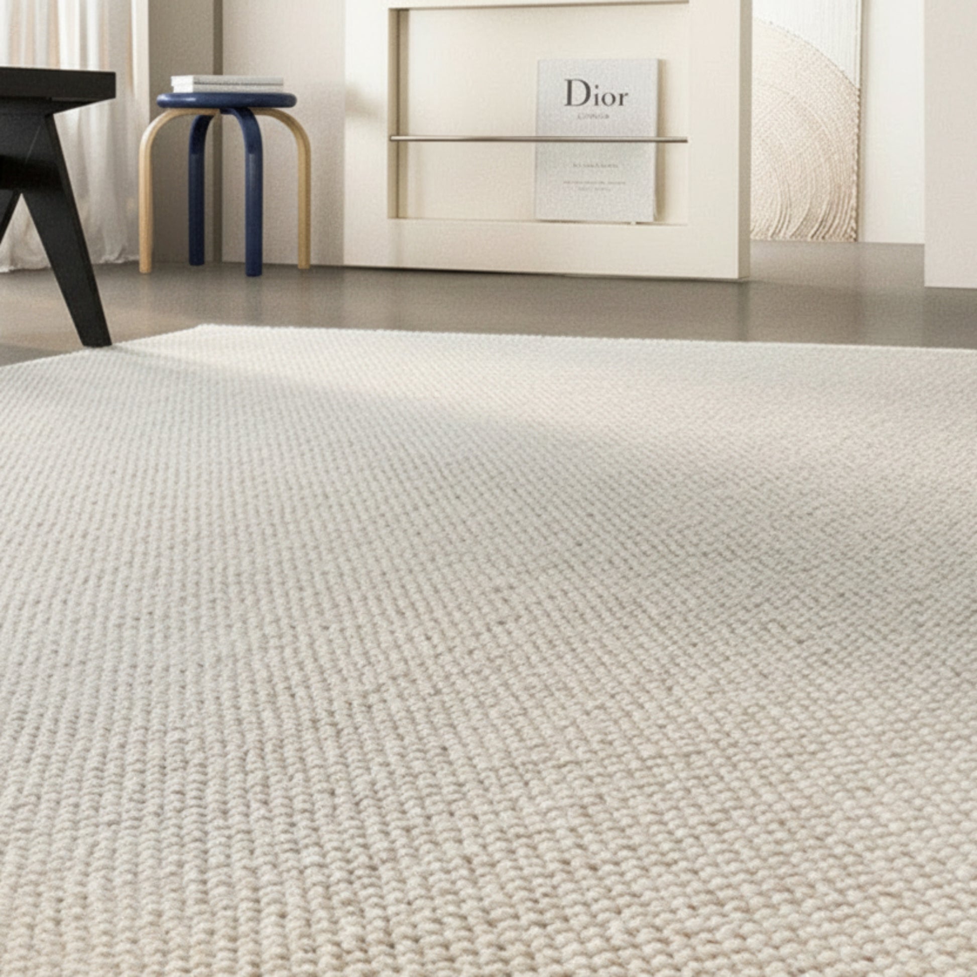 Beige new zealand wool woven carpet in a modern living room setting with furniture and decor. 