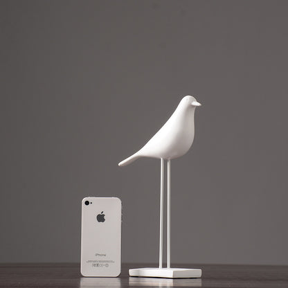 One white Nordic bird decoration made from resin, designed in a nordic and minimalist style, placed on a grey  background.