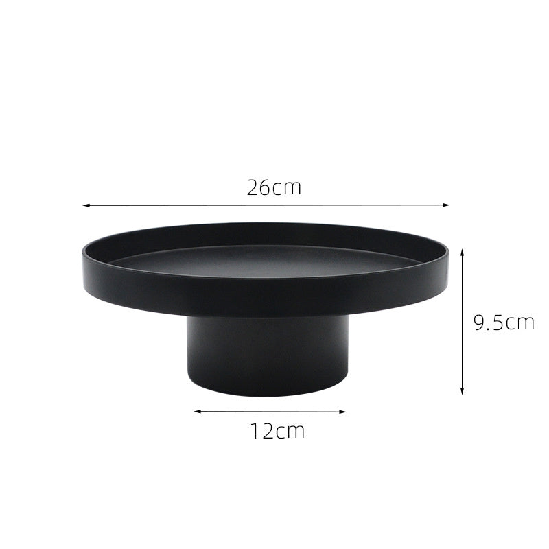 Round black storage tray with measurements on a white background. Minimalist home decor. Timeless and minimalist design. 