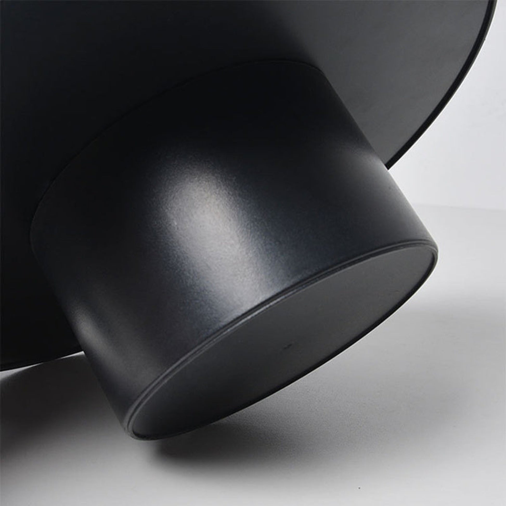 Close-up of a black tray with a modern design on a light gray background. Minimalist home decor. Timeless and minimalist design. 