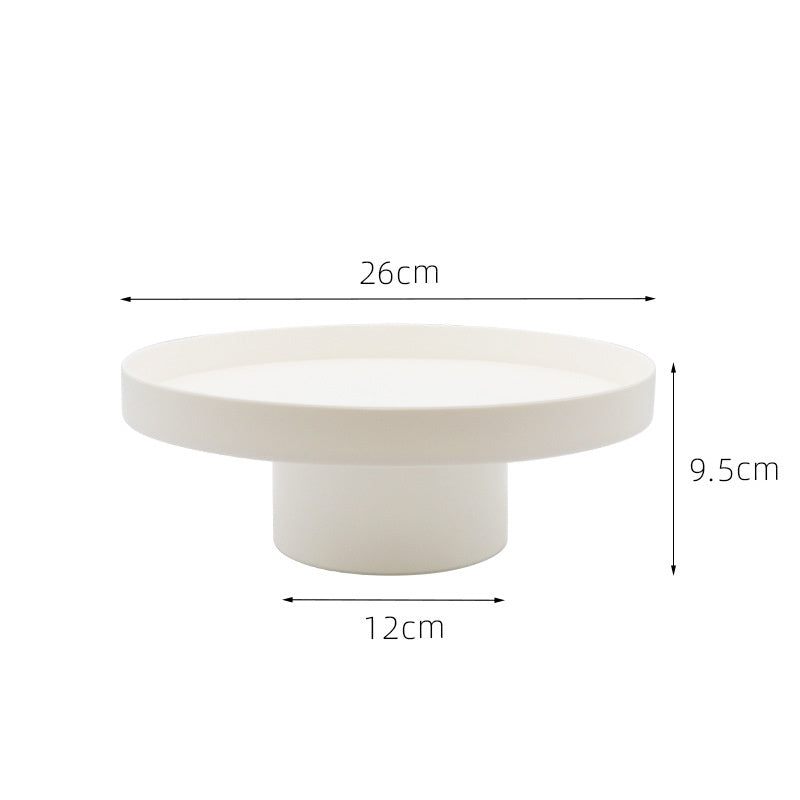 Round white storage tray with measurements on a white background. Minimalist home decor. Timeless and minimalist design. 