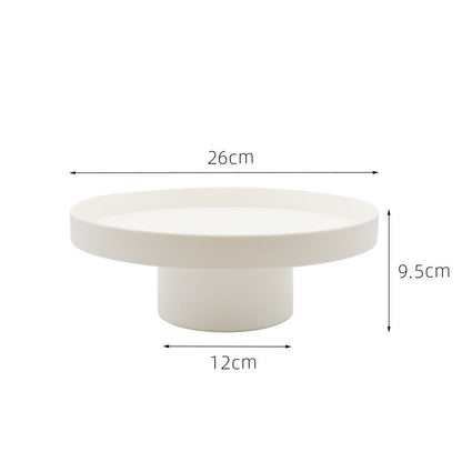 Round white storage tray with measurements on a white background. Minimalist home decor. Timeless and minimalist design. 