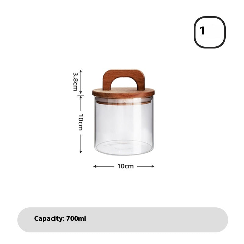A set of clear glass sealed storage tanks with wooden lids, in various sizes, used for storing dry food and spices - with measurements on a white background. 