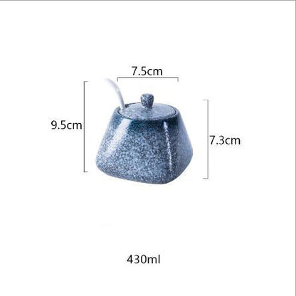 Blue seasoning spice jar with white spoon and dimensions on a white background. 430ml. 
A set of ceramic seasoning spice jars with lids and spoons, displayed in beige, brown, black, and white colors.