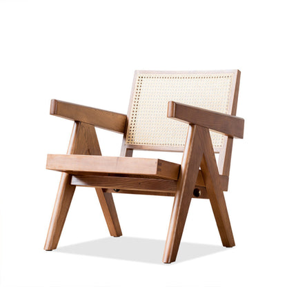 Deep wooden chair with wicker backrest on a white background. Minimalist furniture design. Modern chair interior with clean lines, natural materials and a timeless pieces that brings warmth. 