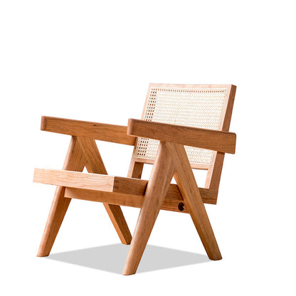 A medieval-inspired solid wood chair with a beige woven seat and backrest, placed on a white floor against a white background. Modern chair interior with clean lines, natural materials, and a timeless pieces that brings a warm atmosphere. 