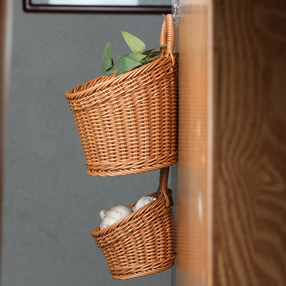 Wicker wall baskets with plants hanging on a wooden surface and pictured from the side. On a wooden wall and on a grey background. Kitchen, living room or any room. 