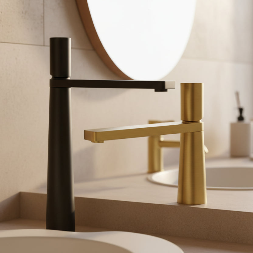 Modern bathroom faucet with black and gold design in a bathroom setting on a beige bathroom background. Minimalist bathroom or kitchen faucet with premium copper faucet. Timeless design for warm and modern interiors. 