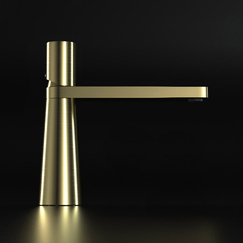 A gold colored basin faucet (small) with a sleek design, displayed against a black background.  Minimalist bathroom or kitchen faucet with premium copper faucet. Timeless design for warm and modern interiors.