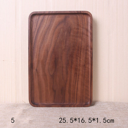 A collection of square and rectangular walnut wooden plates in various sizes, with a hand-painted texture, displayed on a beige background. Earthy tones and whole wood. Calm and minimalist interior atmosphere.