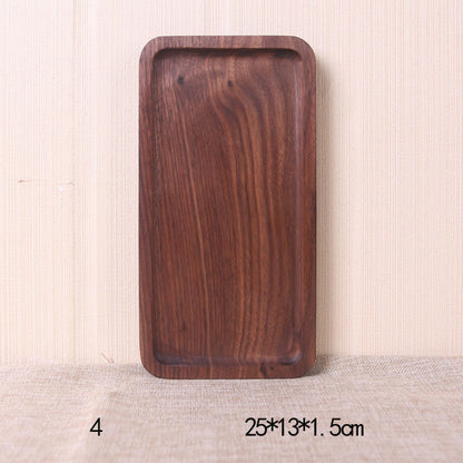 A collection of square and rectangular walnut wooden plates in various sizes, with a hand-painted texture, displayed on a beige background. Earthy tones and whole wood. Calm and minimalist interior atmosphere.