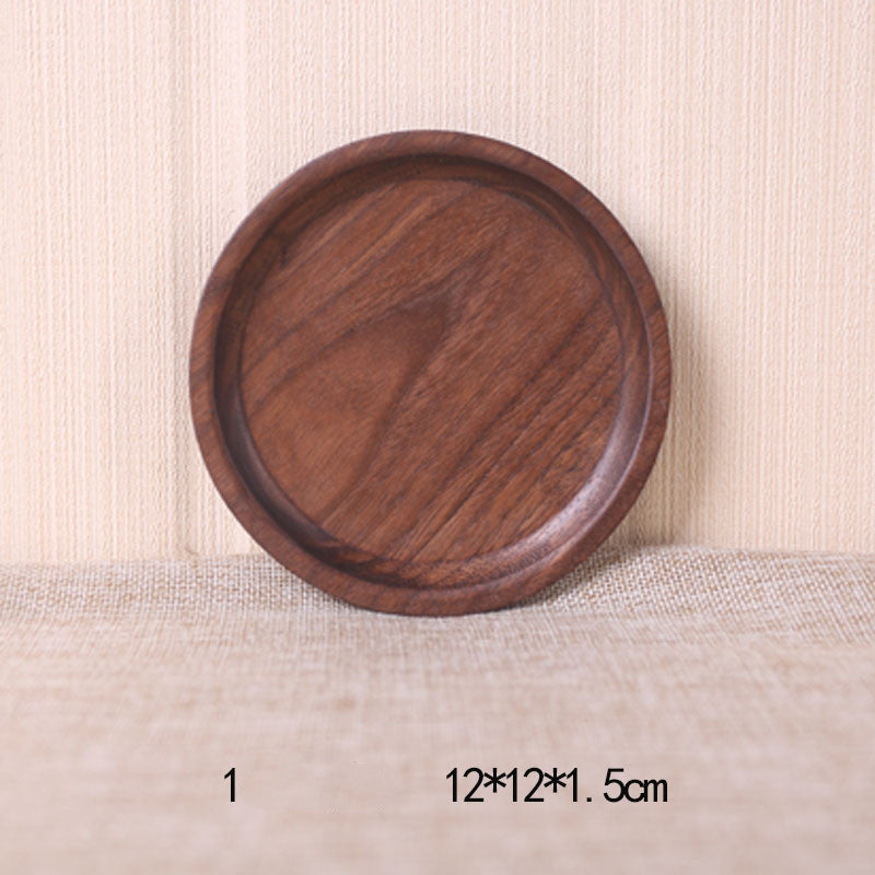 A collection of square and rectangular walnut wooden plates in various sizes, with a hand-painted texture, displayed on a beige background. Earthy tones and whole wood. Calm and minimalist interior atmosphere. 