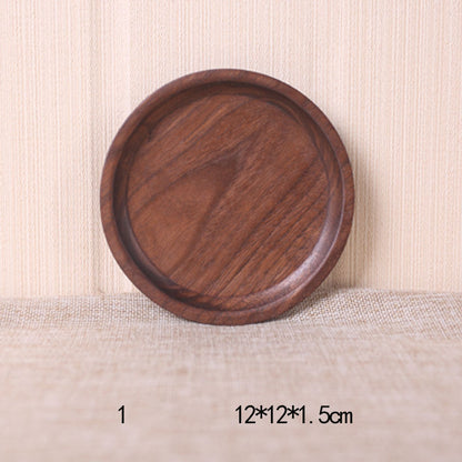 A collection of square and rectangular walnut wooden plates in various sizes, with a hand-painted texture, displayed on a beige background. Earthy tones and whole wood. Calm and minimalist interior atmosphere. 