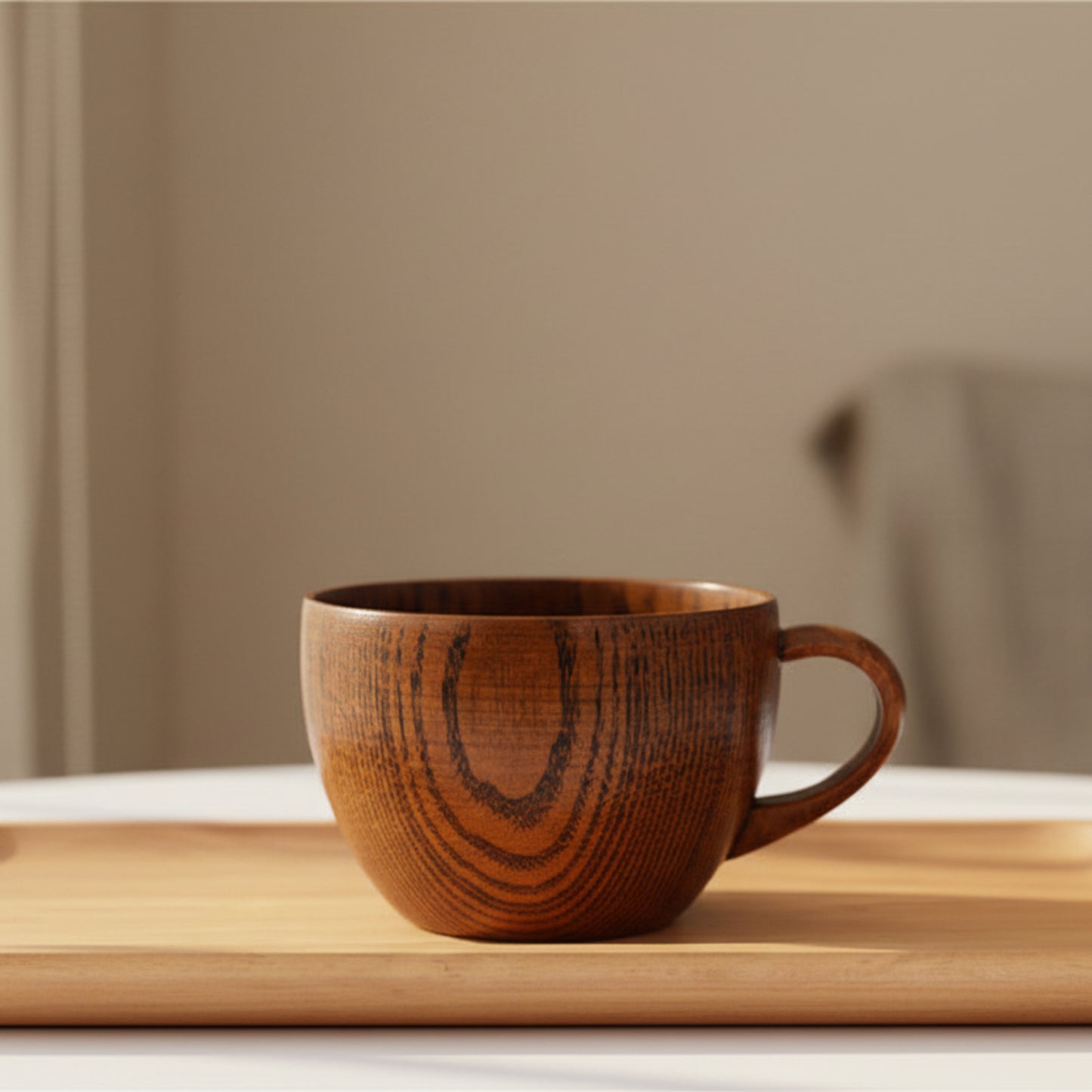 Whole wood mug on a wooden surface with a beige background. Nature inspired and warm natural decor styling. 